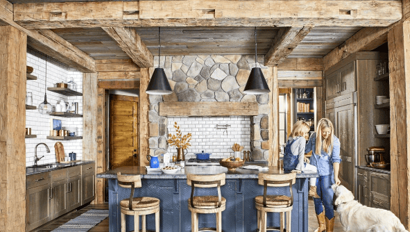 modern kitchen in log cabin blue cabinets and subway tile.