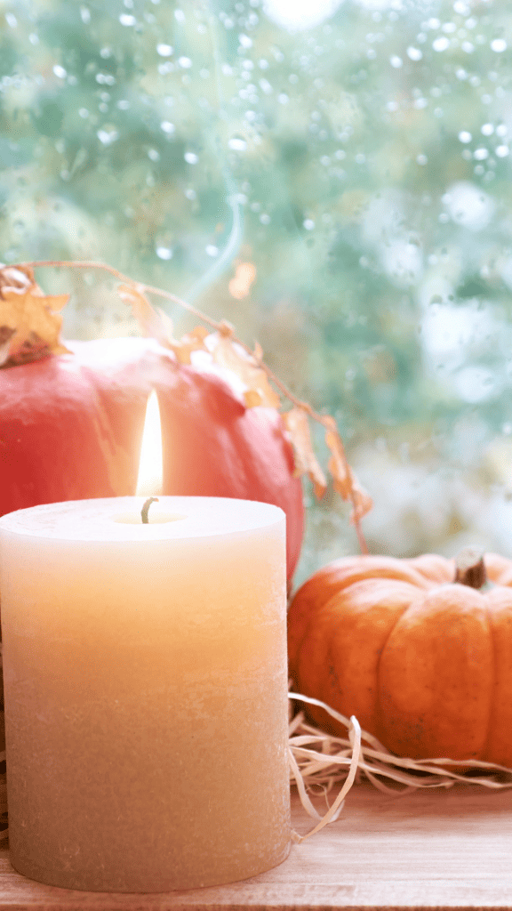fall wallpaper for your phone candle and pumpkins stacked
