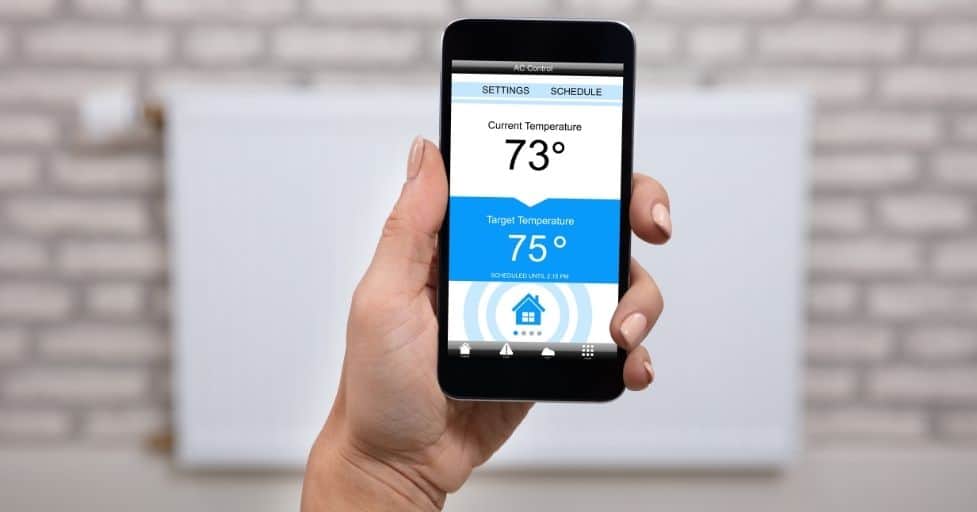 a smart phone showing smart thermostat settings